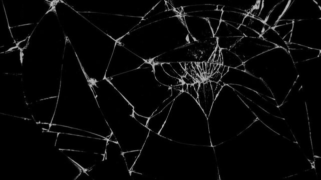 Close-up of a glass impact crack with detailed radial fractures on a black background, perfect for simulating broken glass effects or intense cinematic scenes