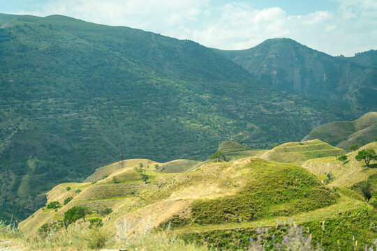 A beautiful mountain landscape with green hills and grassy slopes