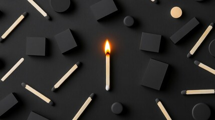 Lit match among unlit matches and shapes on black background