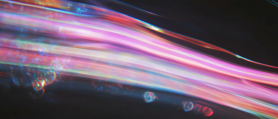 Vibrant rainbow light trails convey energy and speed against a dark backdrop