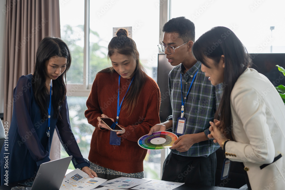 Wall mural group of software engineers design ux/ui for applications on smartphone/laptop