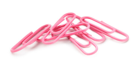 Many pink paper clips isolated on white