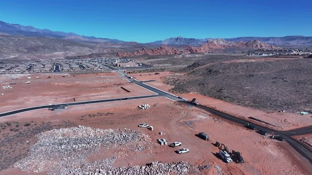 Aerial construction heavy equipment Utah overhead pull 2. ground preparation. Economic boom in housing development and subdivision. Southwestern desert Hurricane Utah. Residential homes neighborhood.