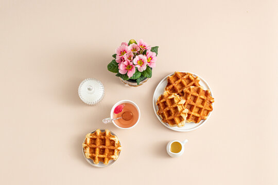 Waffles and Tea with Flowers in Soft Beige Tones