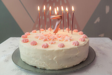 Birthday cake with pink decoration for 7 years