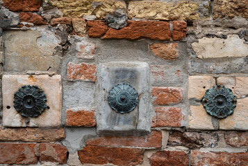 Rustic brick wall with decorative metal fixtures