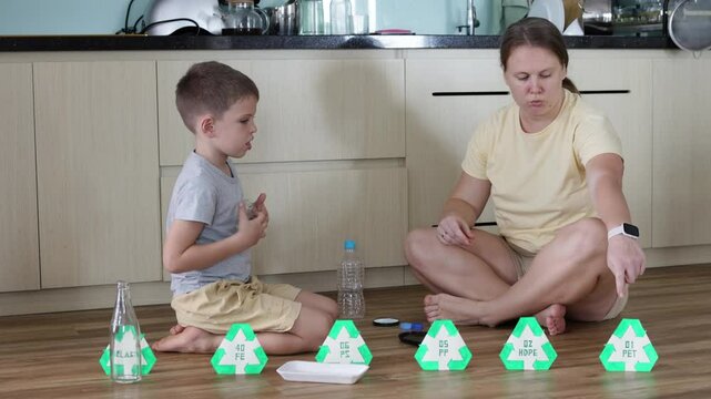 Mother and her young son sort through various items.