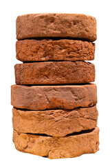 Stack of ancient weathered millstones bricks isolated