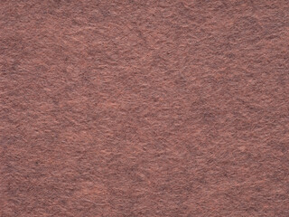 Fototapeta premium Rustic rose felt texture, invoking a warm, nostalgic sentiment with its rich, earthy tones