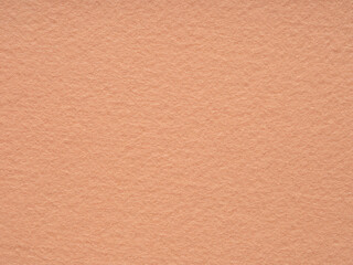 A soothing apricot felt texture, inviting a sense of gentle calm and the subtle warmth of a morning embrace
