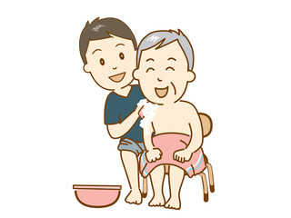 介護士、高齢者の入浴を介助する