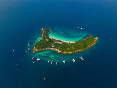Travel landscape of paradise Thai beach with boat. Beautiful island Koh Sak, Pattaya Thailand, aerial view from drone