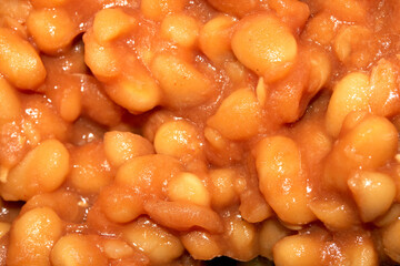 Close Up of tomato baked beans being cooked macro shot