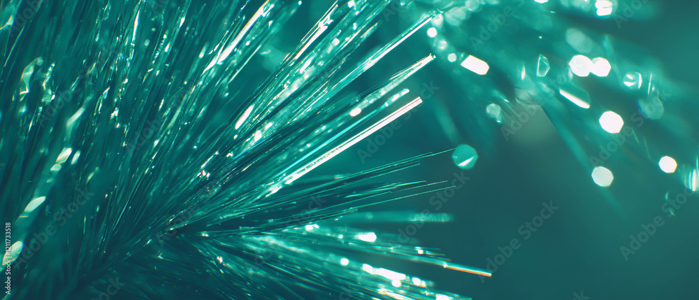 Poster close-up view of vibrant green pine needles showcasing sharp textures and glittering light effects