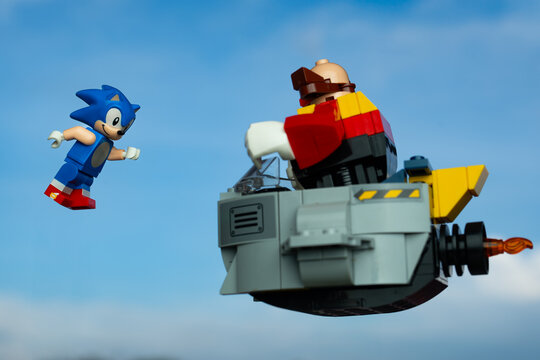 Depok, Indonesia - January 12, 2025: Lego toys photography, lego sonic the hedgehog on green hill zone, with sonic minifigure facing dr. eggman, blue sky background