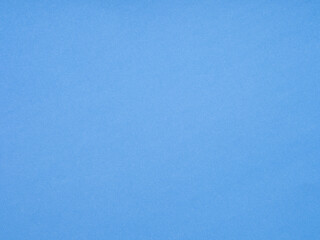 A textured canvas of blue stretches forth, evoking a sense of calm and endless creativity