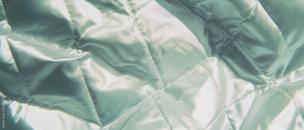 Poster quilted silk fabric featuring padded texture and geometric patterns