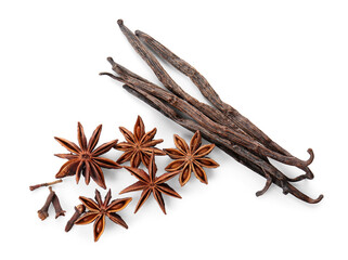 Star anise with cloves and vanilla pods on white background, top view