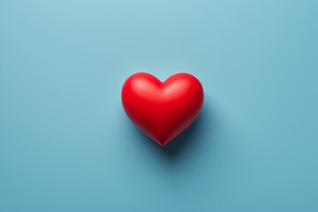 a close up of a red heart on a blue background