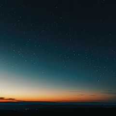 Fototapeta premium A serene twilight sky filled with stars and a colorful horizon.