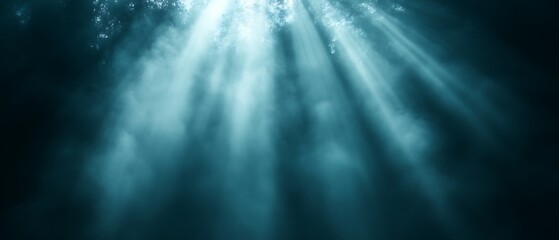 Underwater sunbeams through murky water.