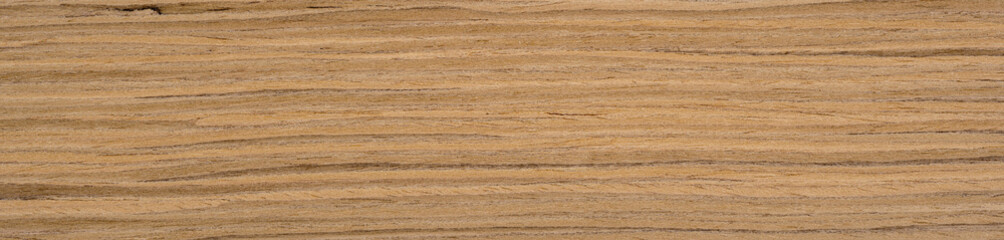 Fototapeta premium Warm ochre hues and earthen tones dance across the smooth surface of this elegant oak veneer