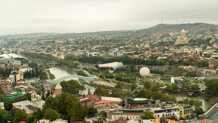 Tbilisi old town aerial panoramic view. Tbilisi is the capital and the largest city of Georgia, lying on the banks of the Kura River. © Gokhan