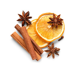 Anise stars with cinnamon and slices of dried orange on white background