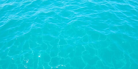 Fototapeta premium Top view of mesmerizing blue ocean waves creating beautiful patterns, nature, pattern