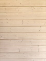 Obraz premium Simple wooden wall vertical background with horizontal planks showcasing natural texture in a bright interior setting
