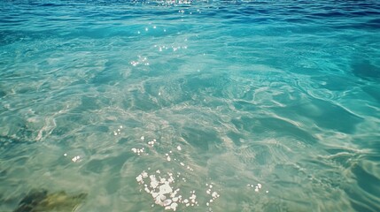 Calm turquoise ocean water, sunny day,  background sea texture, travel backdrop