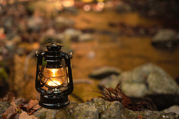 By the riverbank, lit lanterns, autumn camp