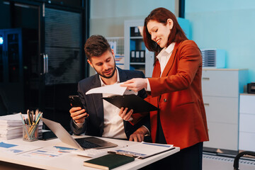 Diversity, business team working at office with laptop and documents on desk, financial adviser analyzing data, employees working overtime.