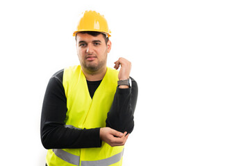 Constructor man touching painful elbow with blank copyspace