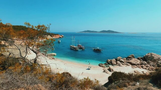 Soguk Su Koyu, Cold Water Bay, is a beach in Turkey located in the Fethiye district of Mugla Province. It is surrounded by mountains, vegetation, and has blue water. The beach is lined with yachts.4К
