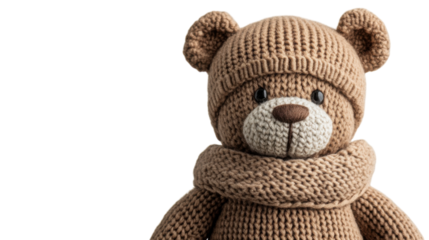 A cozy knitted teddy bear dressed warmly for chilly winter days in a serene indoor setting