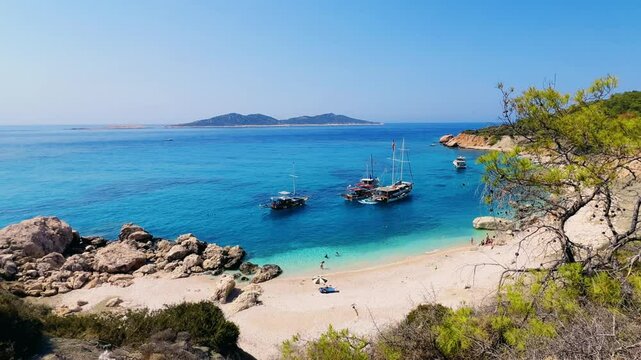 Soguk Su Koyu, Cold Water Bay, is a beach in Turkey located in the Fethiye district of Mugla Province. It is surrounded by mountains, vegetation, and has blue water. The beach is lined with yachts.4К
