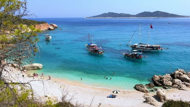 Soguk Su Koyu, Cold Water Bay, is a beach in Turkey located in the Fethiye district of Mugla Province. It is surrounded by mountains, vegetation, and has blue water. The beach is lined with yachts.4К