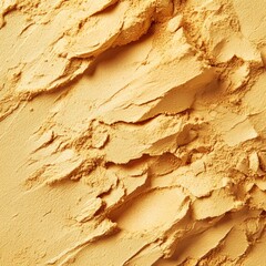 A textured view of a fine yellow powder that highlights its soft, intricate details and vibrant color.