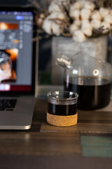 cup of coffee with teapot