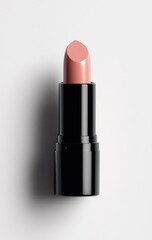 Detailed view of a nude-toned lipstick, showcasing its texture and packaging.