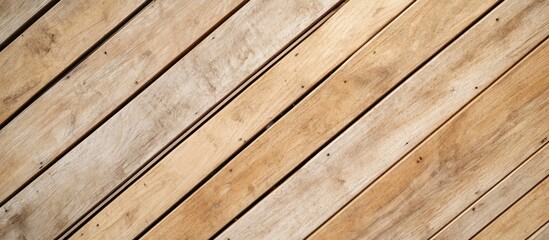 Fototapeta premium Outdoor construction site featuring wooden frame installation for house building project, with diagonal wooden planks in warm tones and empty text space.
