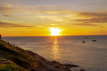 Background of the atmosphere of the sunset at the Phuket seaside, the sunset viewpoint from Promthep Cape, with a beautiful colorful sky.