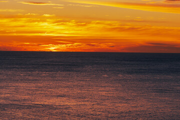 Background of the atmosphere of the sunset at the Phuket seaside, the sunset viewpoint from Promthep Cape, with a beautiful colorful sky.