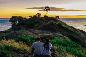 Background of young couples or solo travelers watching the natural light of the sunset at the...