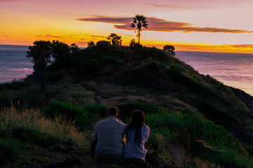 Background of young couples or solo travelers watching the natural light of the sunset at the...