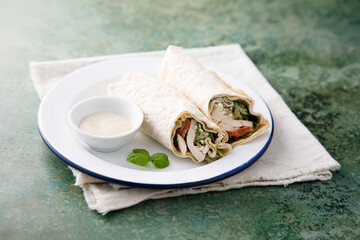 Chicken wrap with tomatoes and salad