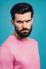 Obraz premium A portrait of a man with a long beard and wearing a bright pink sweater