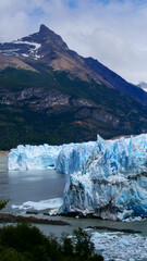 Vertical image of  View of Perito Moreno Glacier with the mountain in the background, Los Glaciares National Park, Argentina