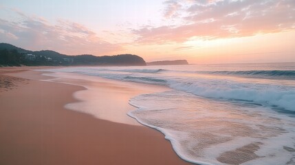 Fototapeta premium A tranquil beach at dawn with soft pink and orange hues in the sky, gentle waves lapping against the shore,
